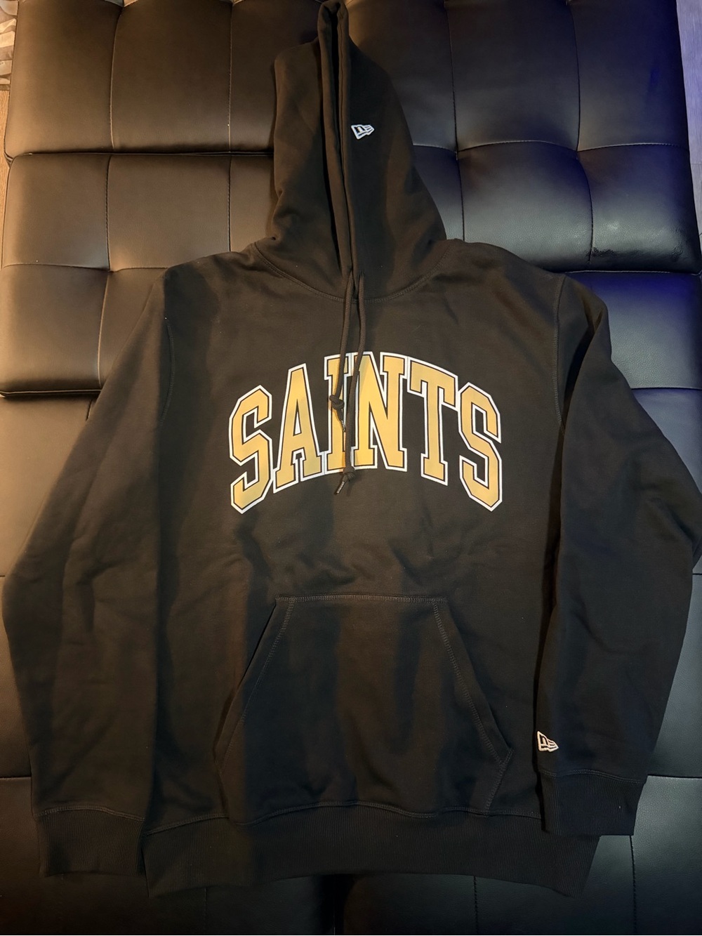 New Era Black Hoodie with Gold 'SAINTS' Arch Logo